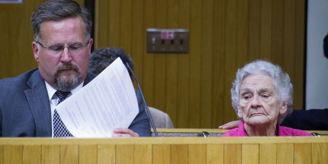 Margaret Kellis with court-appointed attorney last week in Moore County courtroom.