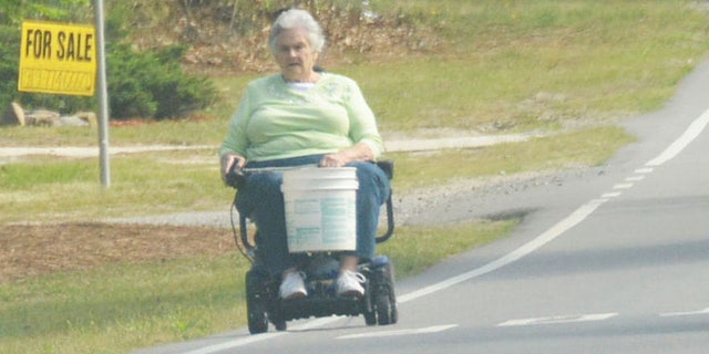 Margaret Kellis operating a motorized wheelchair