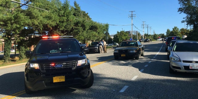 Police and Emergency Medical Services respond to a shooting at a business park in the Edgewood area of Harford County, Md., Wednesday, Oct. 18, 2017.