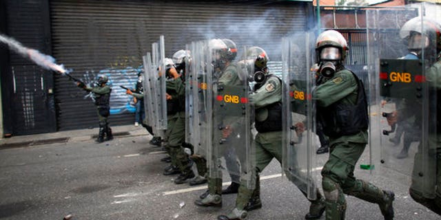 Bolivarian National Guards block protesters from reaching the national ombudsman office in Caracas, Venezuela, April 26, 2017.