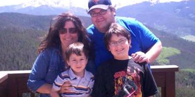 Mason Parrish, front right, with his father, mother and brother.