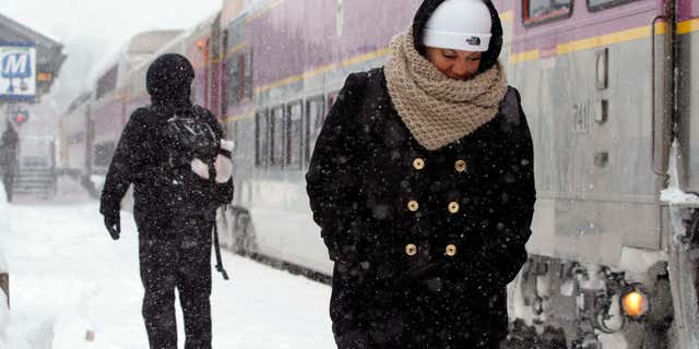Feb. 9, 2015: Passengers wait at the commuter rail train station.
