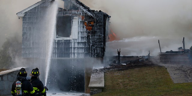 Crews work to knock down a fire in Lawrence, Mass., Thursday, Sept. 13, 2018.