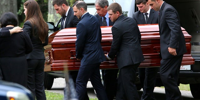 Pall Bearers carry the casket of Vanessa Marcotte at Woodside Cemetery Tuesday, Aug. 16, 2016, in Westminster, Mass. Marcotte, 27, who worked for Google in New York City, was killed Aug. 7 while out running near her mother's Massachusetts home. Investigators have received more than 600 tips, but no arrests have been announced. They say her male assailant may have suffered cuts, scratches and bruises from a struggle. (John Love/The Sentinel & Enterprise via AP)