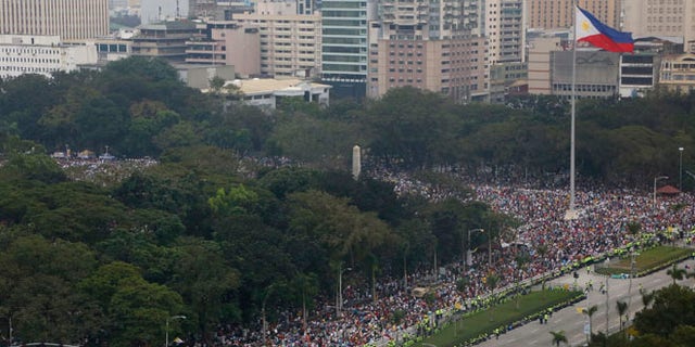 Jan. 18, 2015: Tens of thousands of the faithful fill the Rizal Park area where Pope Francis is to celebrate Mass to an estimated six million in Manila, Philippines. (AP)