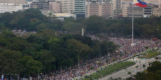 Jan. 18, 2015: Tens of thousands of the faithful fill the Rizal Park area where Pope Francis is to celebrate Mass to an estimated six million in Manila, Philippines. (AP)