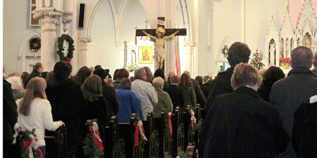 People gathered for mass inside Our Lady of Perpetual Help Church in Buffalo, N.Y., during a Mass mob Jan. 12, 2014.