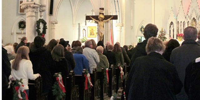 People gathered for mass inside Our Lady of Perpetual Help Church in Buffalo, N.Y., during a Mass mob Jan. 12, 2014.