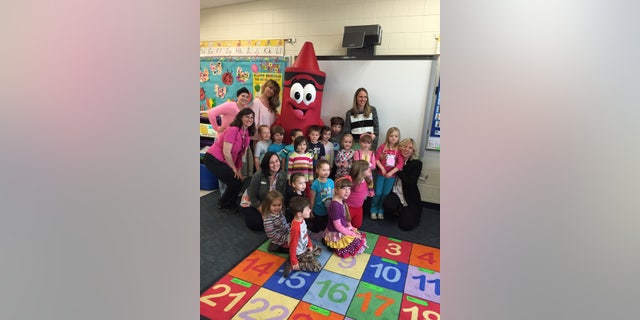 Mattea poses with her classmates Tuesday during the Crayola Experience event at Lester Park Elementary School.