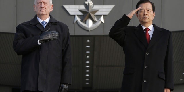 Feb. 3, 2017: U.S. Defense Secretary Jim Mattis, left, and South Korean Defense Minister Han Min Koo salute during a welcome ceremony for Mattis at the Defense Ministry in Seoul.
