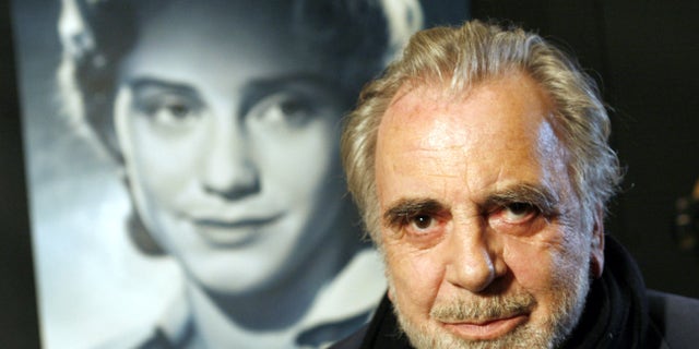 Jan. 30, 2007 file picture actor Maximilian Schell poses in front of a poster of his sister Maria Schell in Frankfurt, Germany.