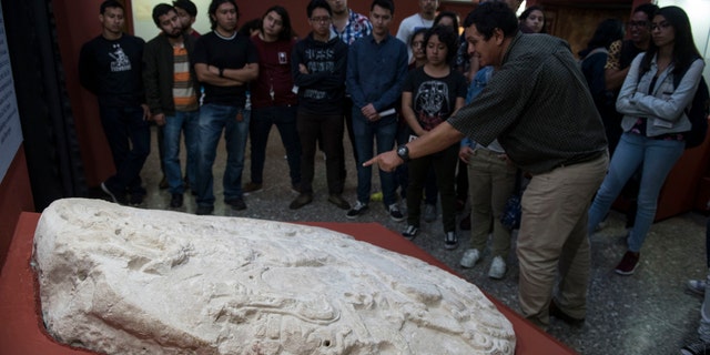 The carved altar at the National Museum of Archaeology and Ethnology in Guatemala City, Wednesday, Sept. 12, 2018. (AP Photo/Oliver de Ros)