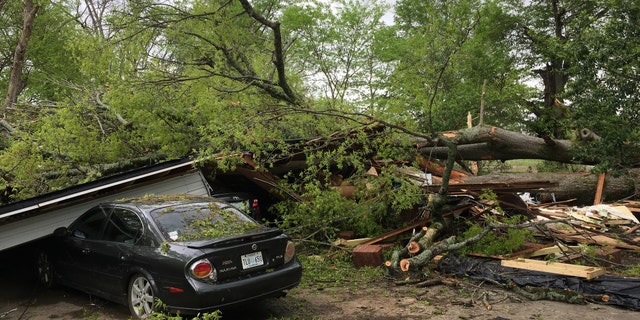 Mayor Johnny Thomas told Fox News he and his wife were home watching TV when the strong storms caused this massive tree to fall and obliterate their home.