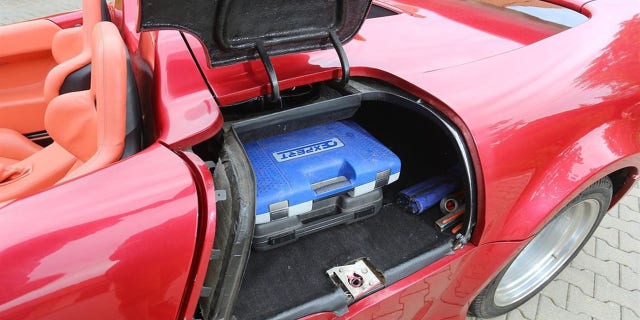 The tube frame chassis design left enough room for a clever side trunk, maintaining some of the Corvette's practicality.
