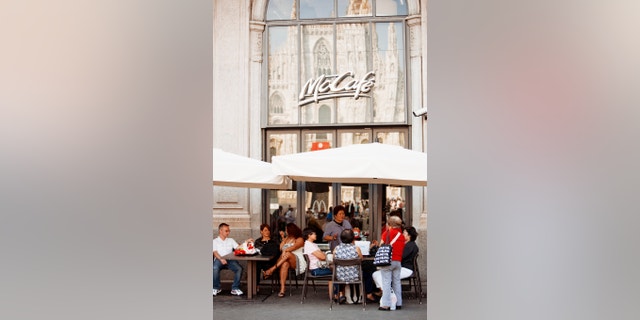 McCafe at Piazza del Duomo with Cathedral reflection, Milan, Italy