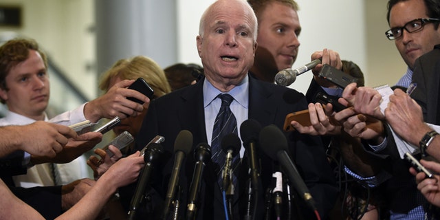 July 8, 2014: Sen. John McCain, R-Ariz., speaks to reporters on Capitol Hill in Washington.