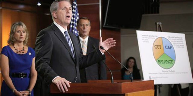 FILE: UNDATED: House Majority Leader Kevin McCarthy, center, talks on Capitol Hill about the debt ceiling, Washington, D.C.