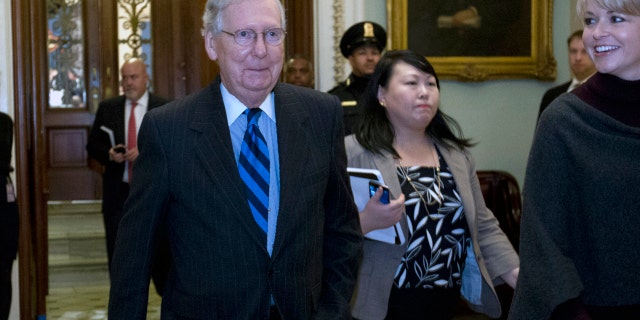 Senate Majority Leader Mitch McConnell leaves the Senate floor Sunday evening.