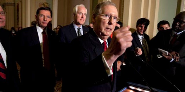 Senate Minority Leader Mitch McConnell speaks to reporters after the weekly caucus luncheons in Washington on Jan. 25.