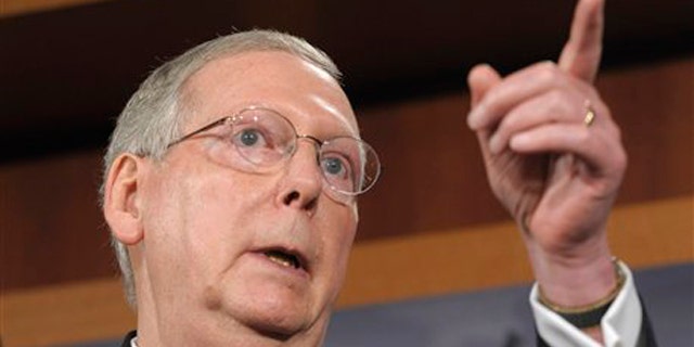 July 12: Senate Minority Leader Mitch McConnell gestures during a news conference on Capitol Hill.