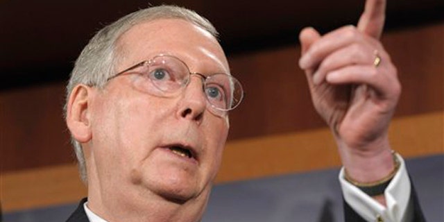 July 12: Senate Minority Leader Mitch McConnell gestures during a news conference on Capitol Hill.