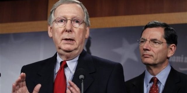Nov. 3: Senate Minority Leader Mitch McConnell, R-Ky., speaks and Sen. John Barrasso, R-Wyo., listens during a rare weekend session of the U.S. Senate.