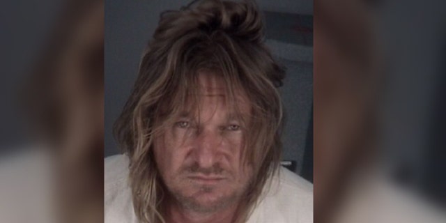 Brandon McCray, 47, is accused of slashing two people with a ninja sword after an argument over a pair of socks.