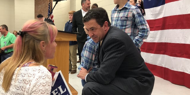 State Senator Chris McDaniel talks with a supporter after giving remarks at a rally in his hometown of Ellisville, Miss. This is the second time McDaniel has run for the U.S. Senate after losing a 2014 GOP primary runoff race by over 7,000 votes.