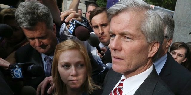 Aug. 21, 2014: Former Virginia governor Bob McDonnell puts his arm around his daughter Cailin Young as he leaves the federal courthouse in Richmond, Va.