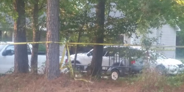 Police tape surrounds home where a young boy was shot and killed Saturday in McDonough, Georgia. (Fox 5 Atlanta)