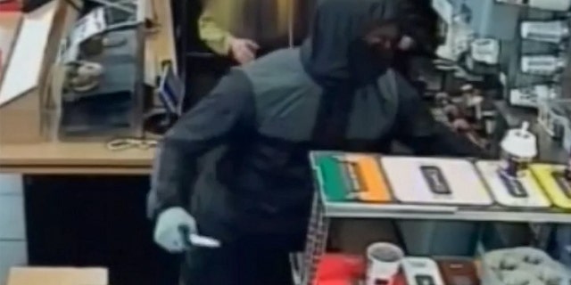Detective Constable Emma Brookes told SWNS police are seeking any information on the robbery and hope someone might recognize the suspect from his clothes.