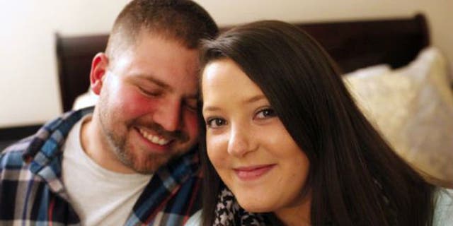 Danny Robinson and Ashley McIntyre, both 26, are engaged and expecting their first child. The couple met after McIntyre donated a kidney to Robinson a year ago. February, 9, 2015. (Photo: Angela Shoemaker, Special to the CJ)