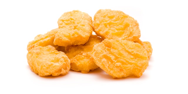 heap of chicken nuggets isolated on white background