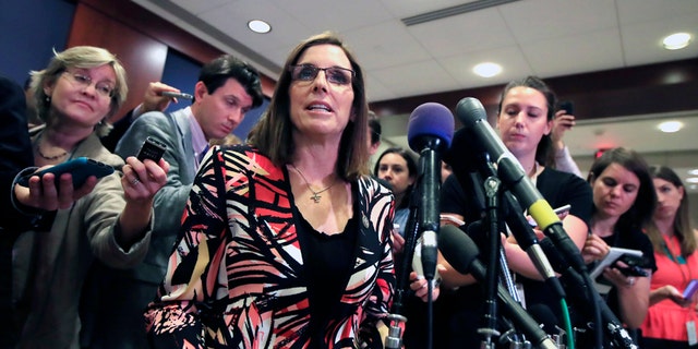 FILE - In this June 14, 2017 file photo Rep. Martha McSally, R-Ariz. speaks to reporters on Capitol Hill in Washington. McSally has told Republican colleagues that she's running for the U.S. Senate seat being vacated by Sen. Jeff Flake. McSally hasn't made a formal announcement of her intention to run in next year's Republican primary. But Arizona Rep. David Schweikert said Tuesday, Nov. 7, 2017, that she told fellow Arizona GOP members of Congress that she was running. (AP Photo/Manuel Balce Ceneta,File)