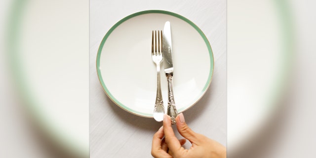 In the U.K. this is the way you leave you cutlery when you are finished with a meal.