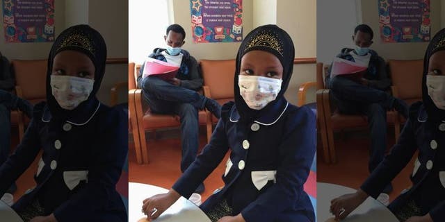 Amira Hassan went to the hospital's clinic for a routine wellness check, but she and her father both had to wear a mask to protect them from measles after an outbreak has sickened more than 30 children in Minnesota.