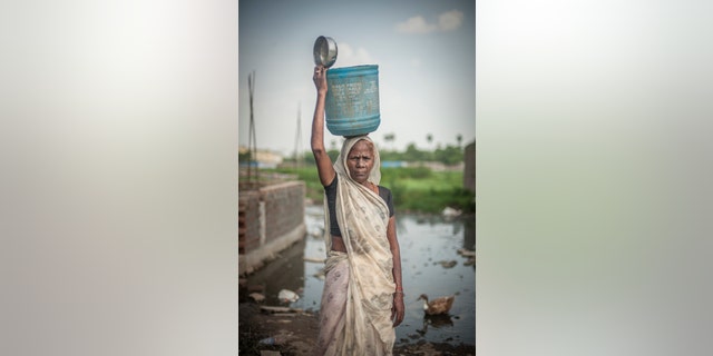 Uma Devi, aged 60-70, has worked as a manual scavenger since the aged of 11/12 in Sangi Masjid slum, Patna, Bihar, India.She has four sons and one daughter.