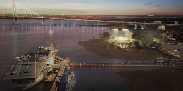 This architectural rendering shows the proposed National Medal of Honor Museum at night. The USS Yorktown is in the foreground and the Ravenel Bridge behind the museum. The star-shaped chapel can be seen directly in front of the museum building. (National Medal of Honor Museum)