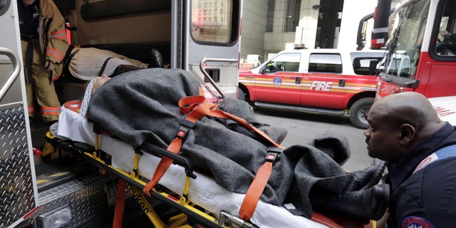 Jan. 9, 2013: An injured passenger of a New Jersey ferry is loaded into an ambulance, in New York.