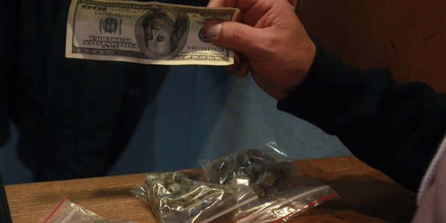FILE-A patient buys bags of medical marijuana at the Coffeeshop Blue Sky dispensary in Oakland, Calif.