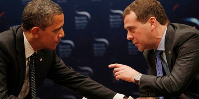 March 26, 2012: President Obama chats with Russian President Dmitry Medvedev during a bilateral meeting at the Nuclear Security Summit in Seoul, South Korea.