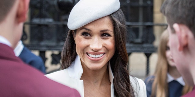 Britain's Prince Harry and his fiancee Meghan Markle meet school children in Dean's Yard in London, Britain March 12, 2018.