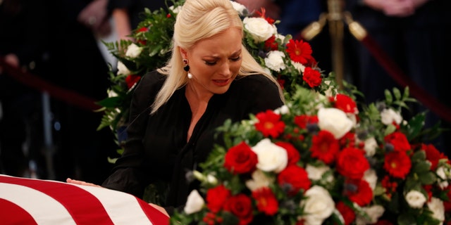 WASHINGTON, DC - AUGUST 31: Meghan McCain, daughter of late U.S. Senator John McCain, touches her father's casket during ceremonies honoring the late US Senator John McCain inside the Rotunda of the U.S. Capitol, August 31, 2018 in Washington, DC. The late senator died August 25 at the age of 81 after a long battle with brain cancer. He will lie in state at the U.S. Capitol Friday, a rare honor bestowed on only 31 people in the past 166 years. Sen. McCain will be buried at his final resting place at the U.S. Naval Academy on Sunday. (Photo by Kevin Lamarque-Pool/Getty Images)