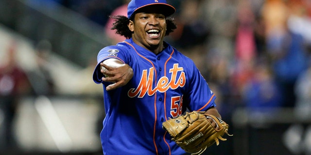 Sept. 10, 2014: New York Mets relief pitcher Jenrry Mejia tosses the ball to throw out Colorado Rockies' Josh Rutledge at first base to end a baseball game in New York. (AP)