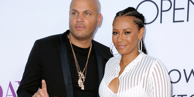 In this April 13, 2016 file photo, Stephen Belafonte, left, and his wife Melanie Brown arrive at the Los Angeles premiere of 