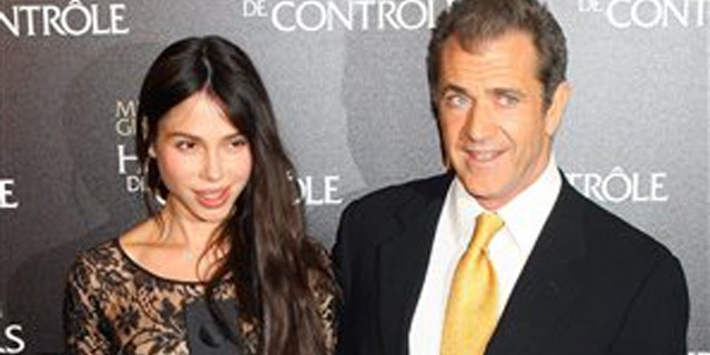 Feb. 4, 2010: Mel Gibson and Oksana Grigorieva arrive at the "Edge Of Darkness" Premiere in Paris.
