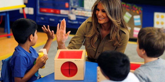 First Lady Melania Trump with children at the American International School of Riyadh, Saudi Arabia in May 2017.