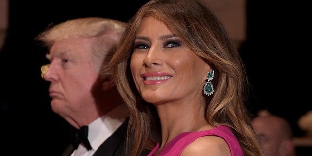 President Donald Trump and first lady Melania Trump arrive for the 60th annual Red Cross Gala at Trump's Mar-a-Lago resort in Palm Beach, Fla., Saturday, Feb. 4, 2017. (AP Photo/Susan Walsh)