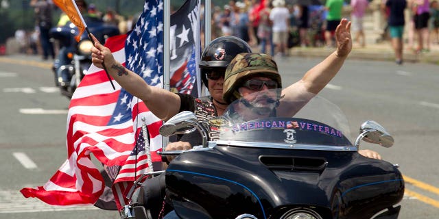 Participants in the Rolling Thunder motorcycle rally ride past Arlington Memorial Bridge ahead of Memorial Day in Washington.