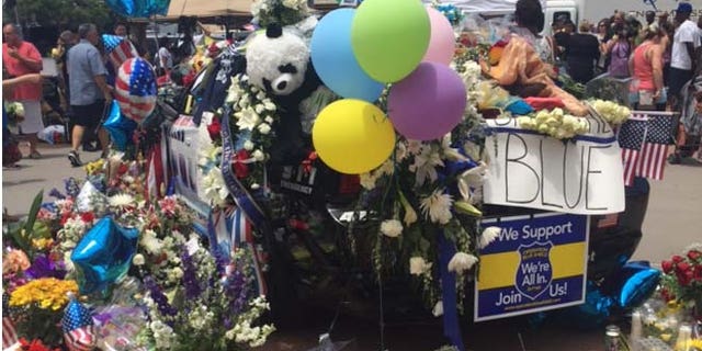 Memorial to five fallen officers outside Dallas Police Headquarters. (Melissa Jacobs)
